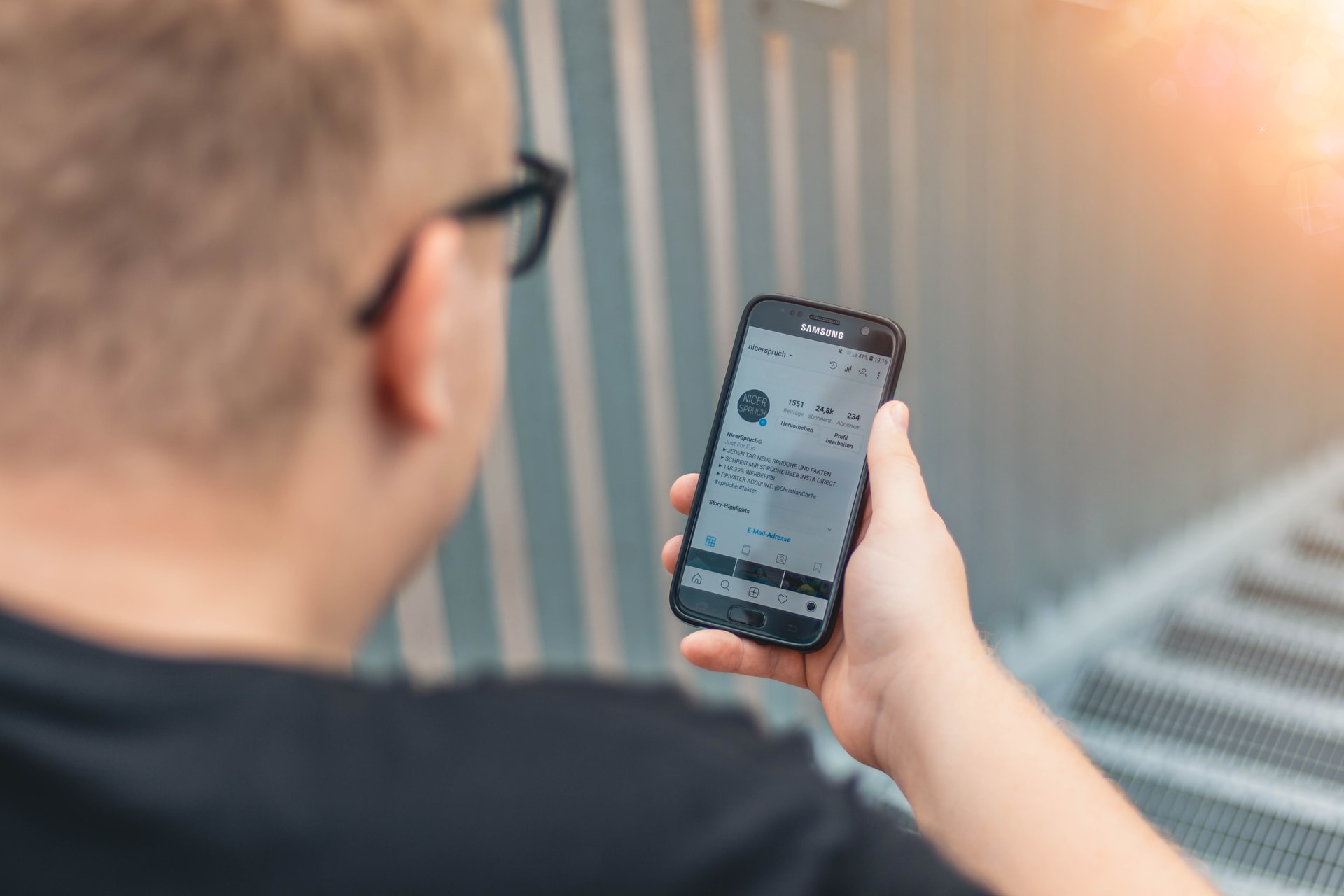 A man using social media on his phone